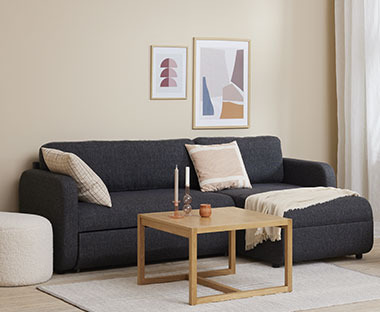 Γωνιακός καναπές κρεβάτι σε σκούρο γκρι χρώμα